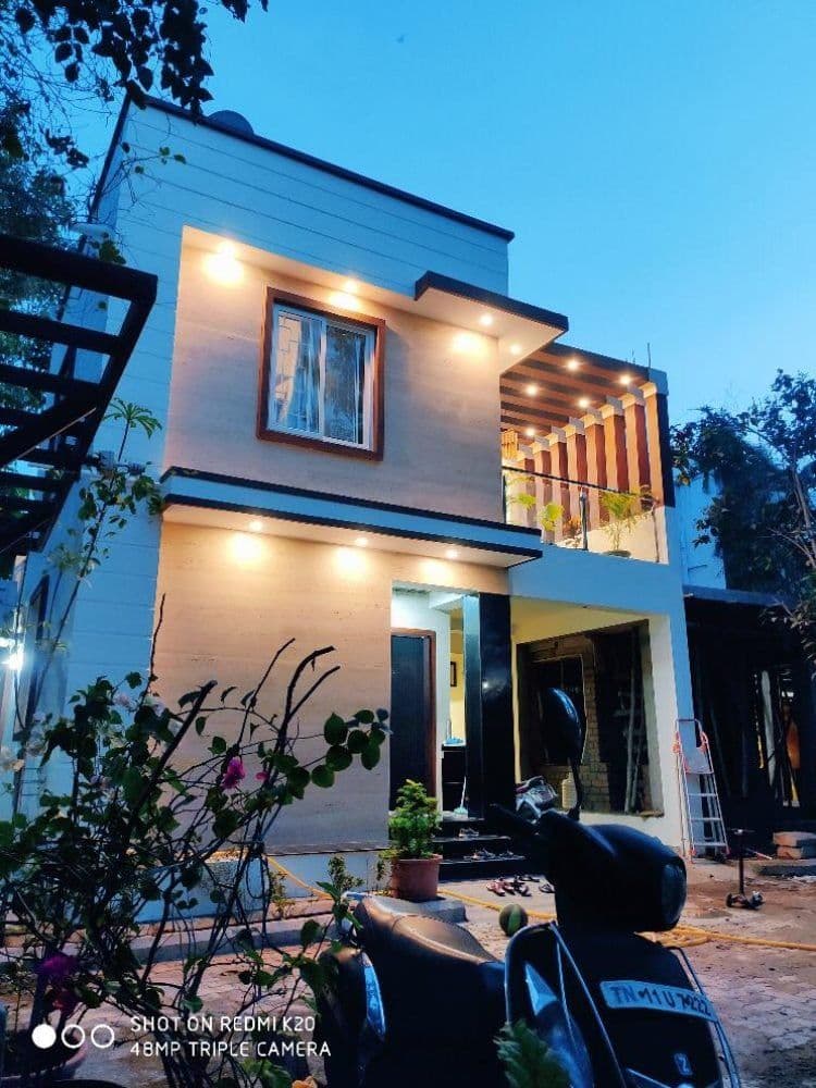 Completed house exterior, illuminated at dusk